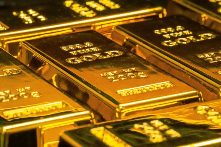 is it better to invest in gold or property